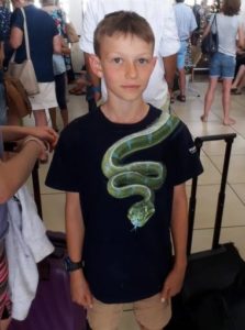 Teenager from New Zealand's forced to take off T-shirt at SA airport because there was a picture of a green snake on it